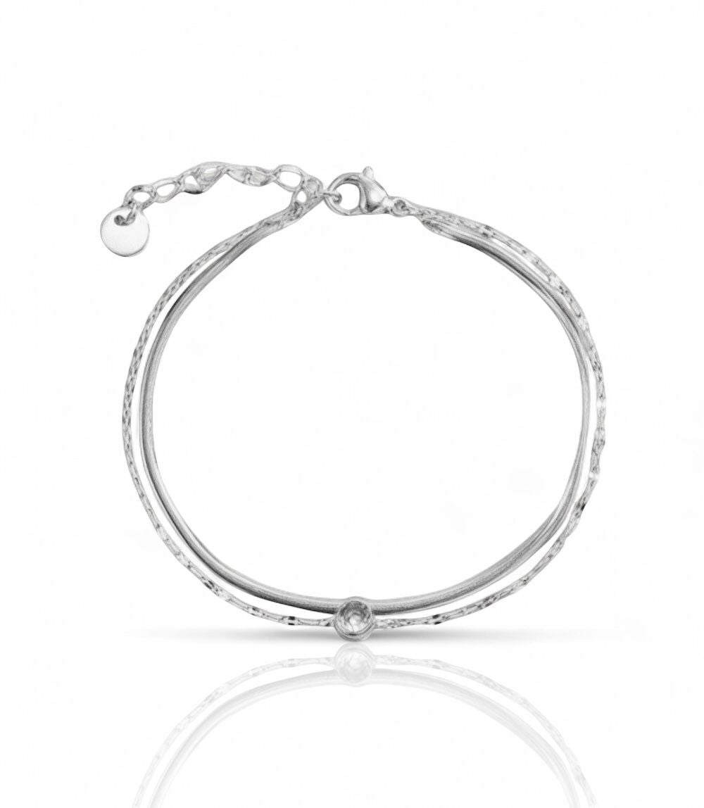 Bracelet fin en acier inoxydable avec maille contrastée et strass central